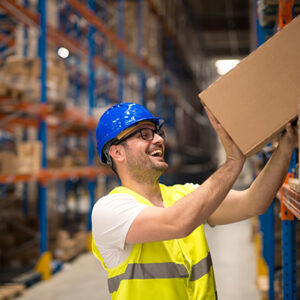 Warehouse worker lifting package